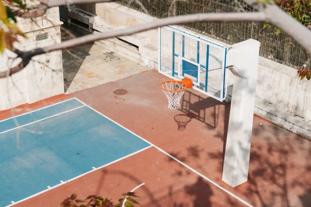 Hard court surface built with concrete primer, ideal for tennis surfaces or basketball in outdoor settings.